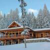 Nestled in the Rocky Mountains on a picture perfect snowy day is this luxury log home for sale at Moose Creek Estates.