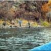 Idaho drift boat steelhead fishing and trying their luck on the river bank.