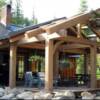 Enjoy lazy afternoons viewing the gorgeous scenery under the shelter of this rustic  timber deck at this Idaho mountain home for sale