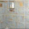 Walk out basement tile shower accented with Southwest tiles.