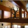 This stunning Iron Quaking Aspen Chandelier created just for this home by North Fork Forge, proudly hangs from the Loft at Moose Creek Estates Idaho mountain log home for sale.