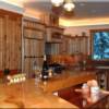 Prepare meals in this inviting kitchen lined with hickory cabinets while you catch a glimpse of elk or deer meandering by the kitchen windows